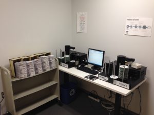 One of NPR’s rip station labs with both “robots” at work reformatting CDs to digital files.