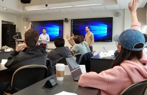 John Burke and Kevin Dong talk with a class