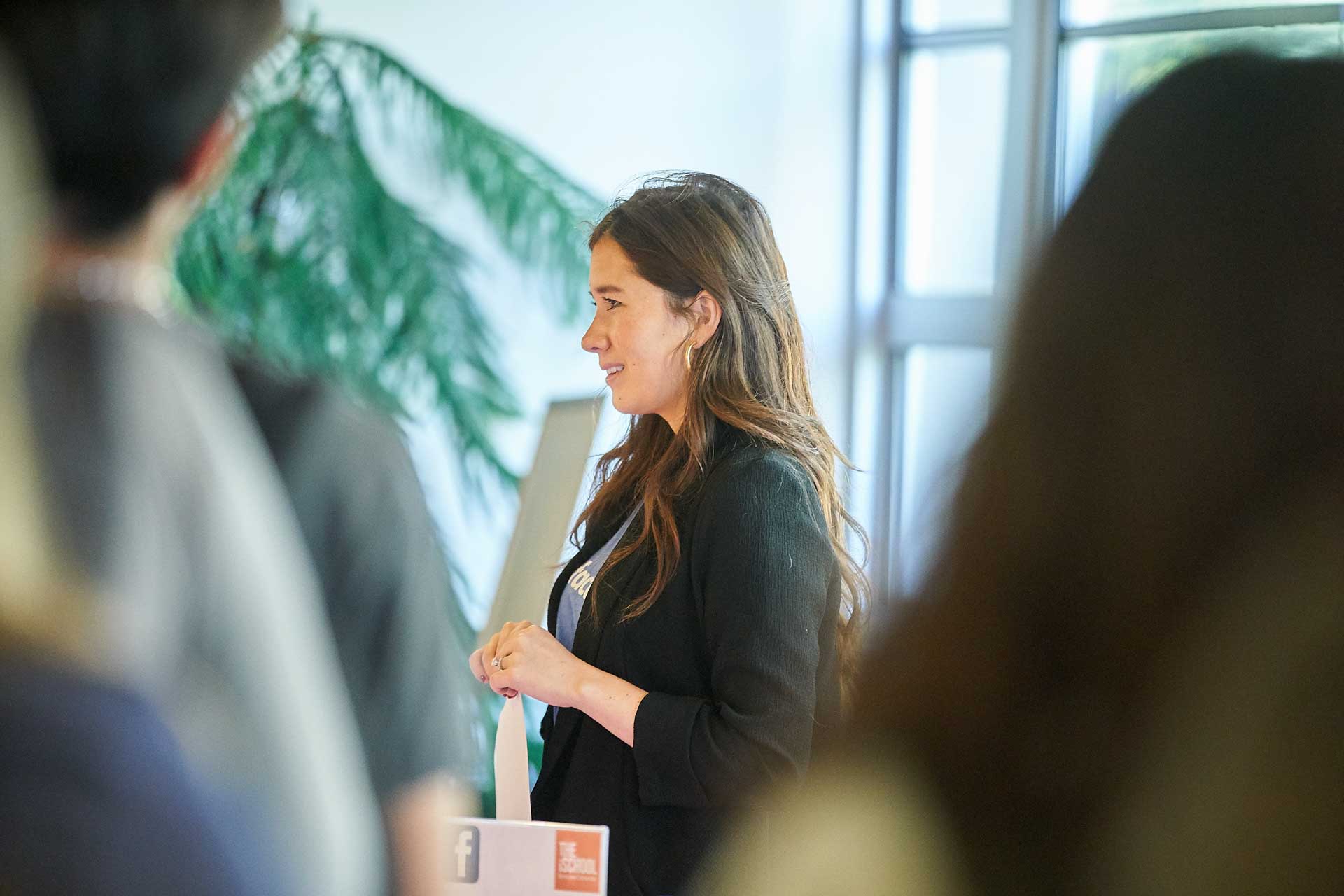 Celeste Drumhiller '14 listens at a Facebook recruiting event