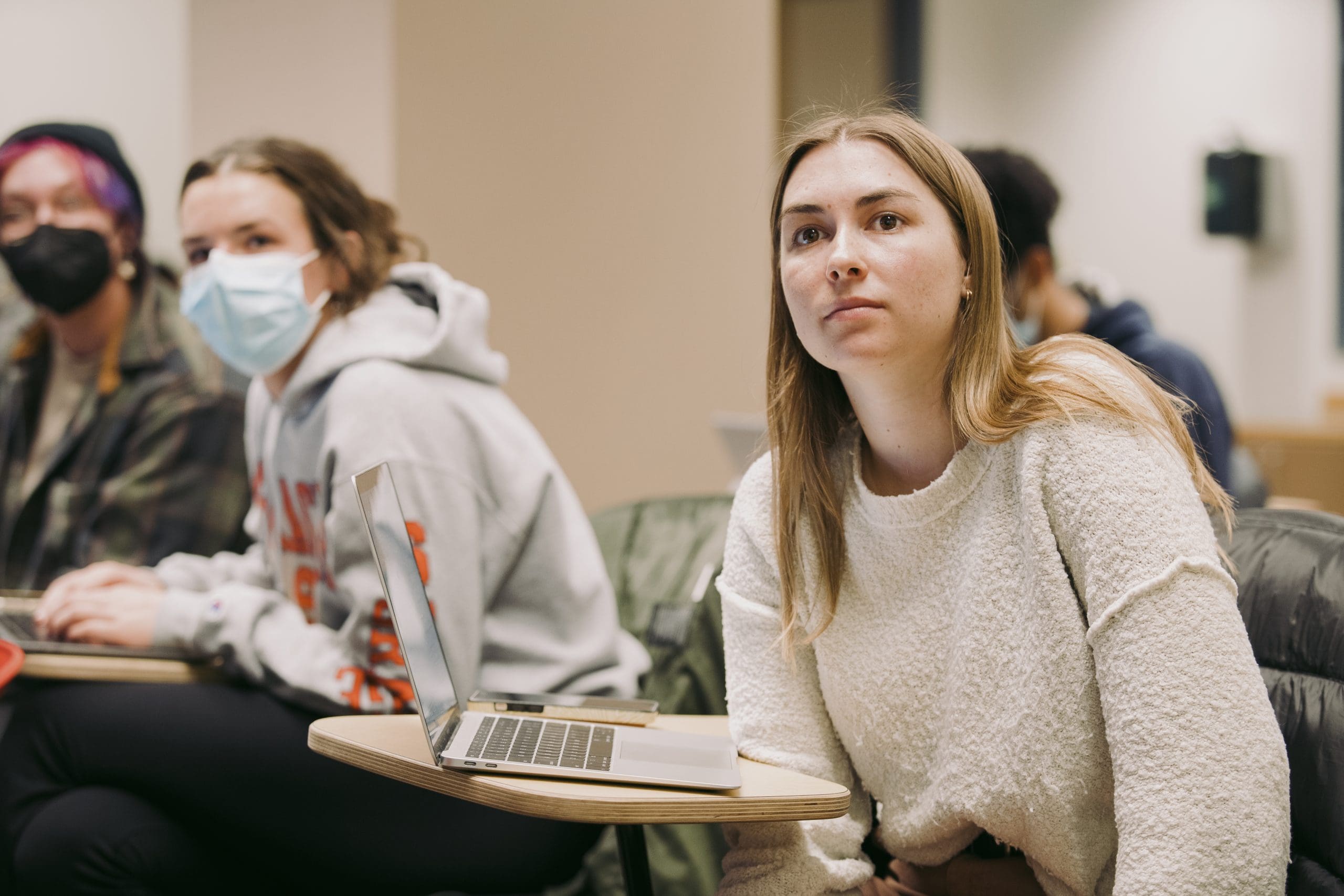 young woman listening in class