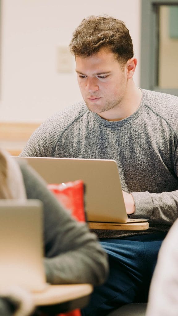 Boy staring at laptop