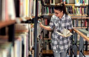 a girl in the stacks