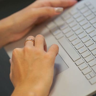 Person typing on a laptop computer