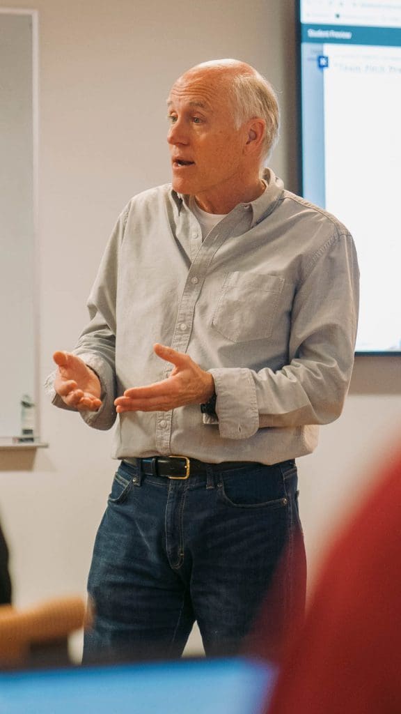 a man presenting in class