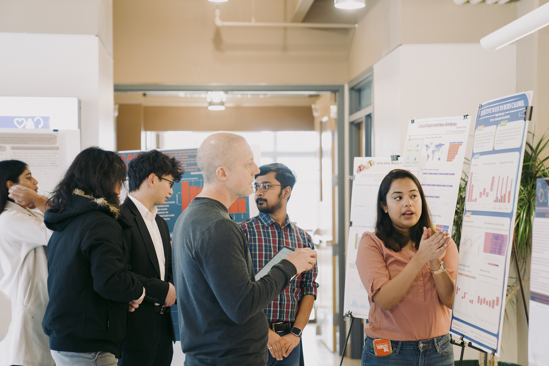 woman presenting data to professor